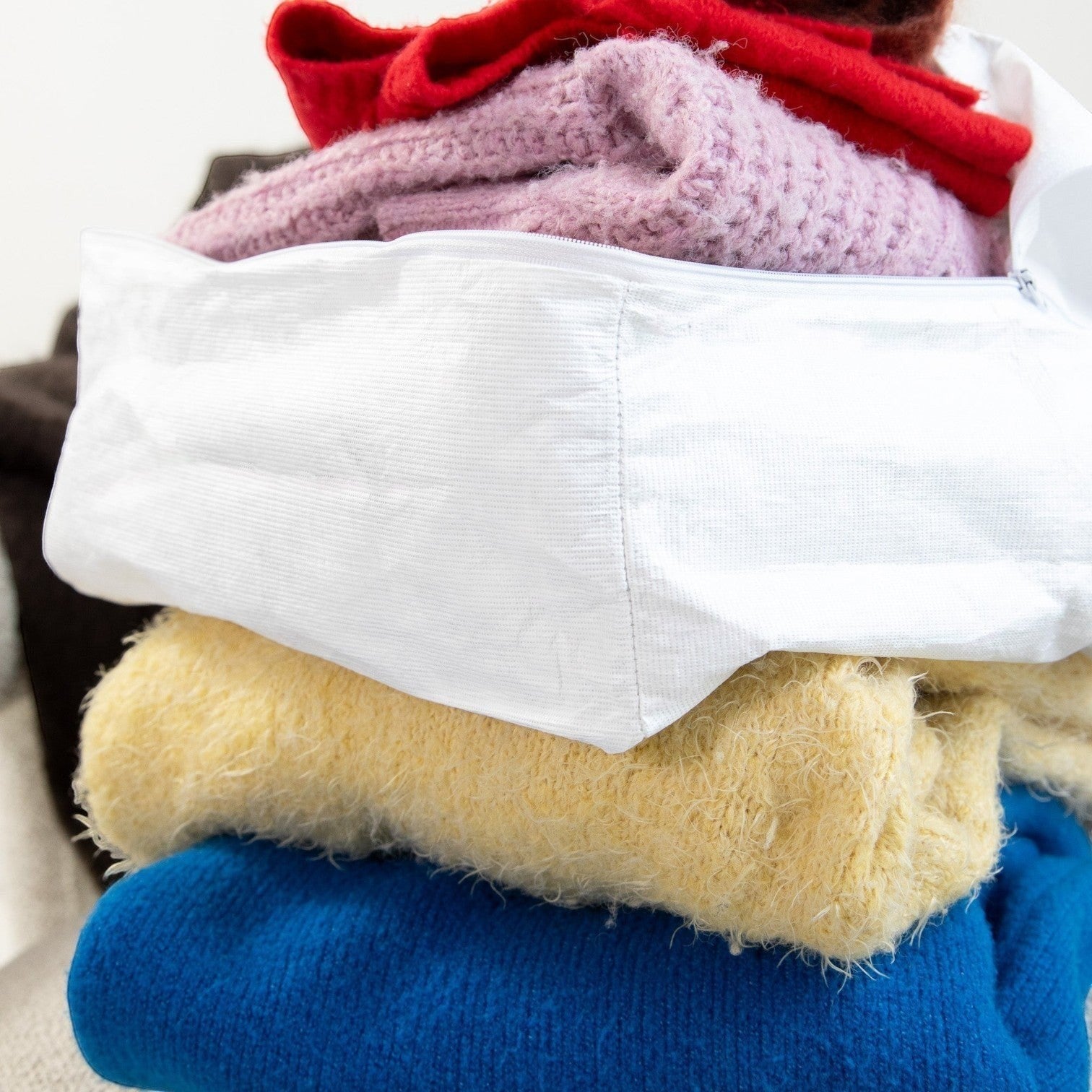Kept Store white travel packing cube, a soft and breathable alternative to plastic packing cubes.