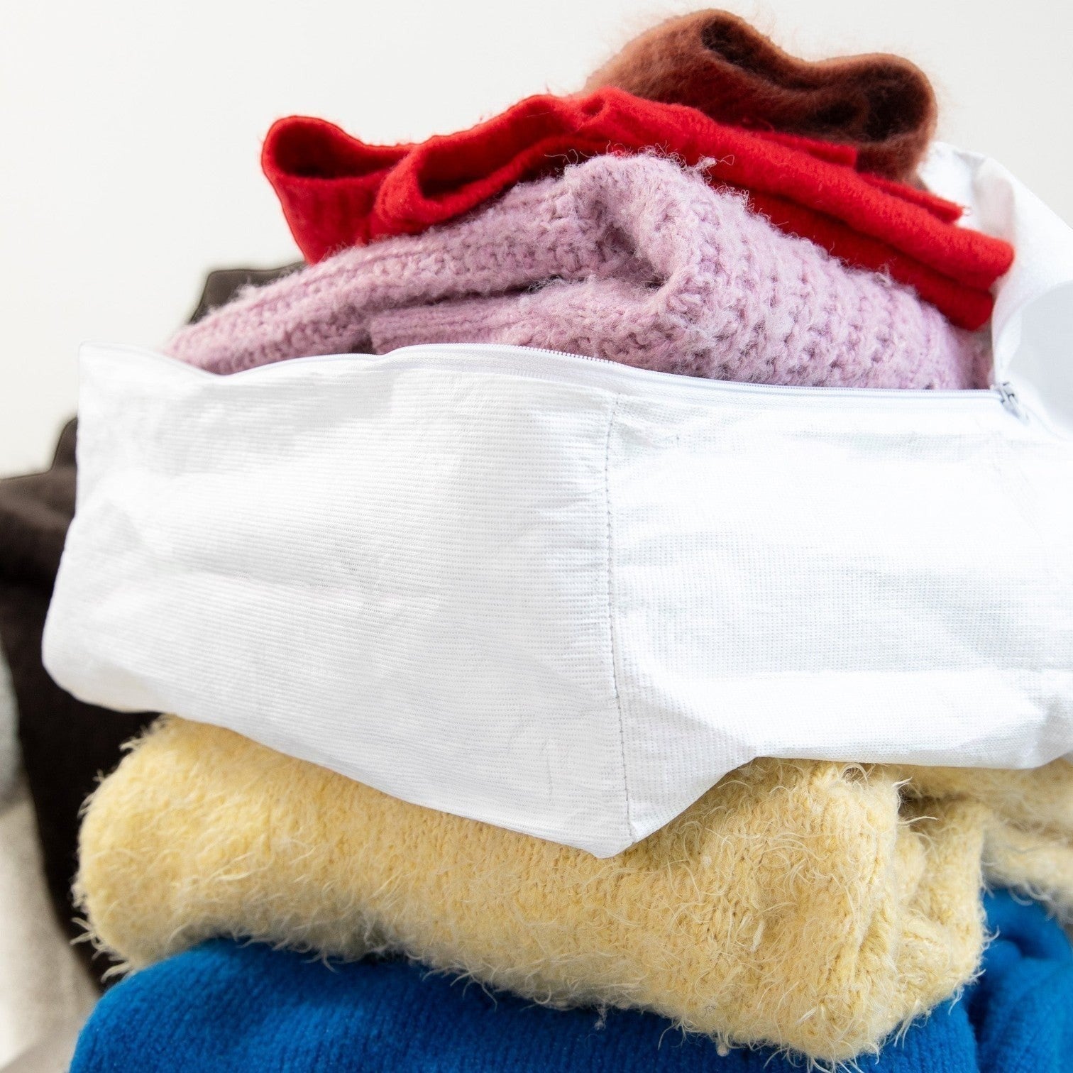 Kept Store small knitwear storage bag in white, museum-grade protection for delicate knits.