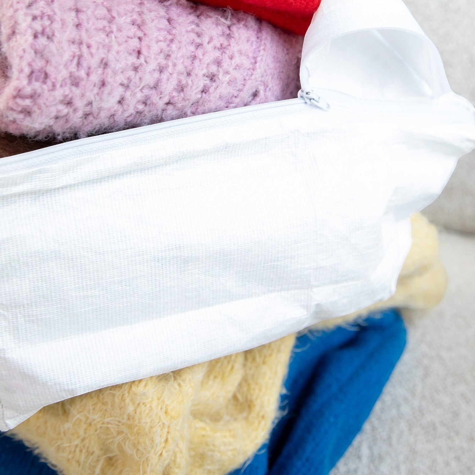 Kept Store small knitwear storage bag in white for storing fine-gauge knitwear.