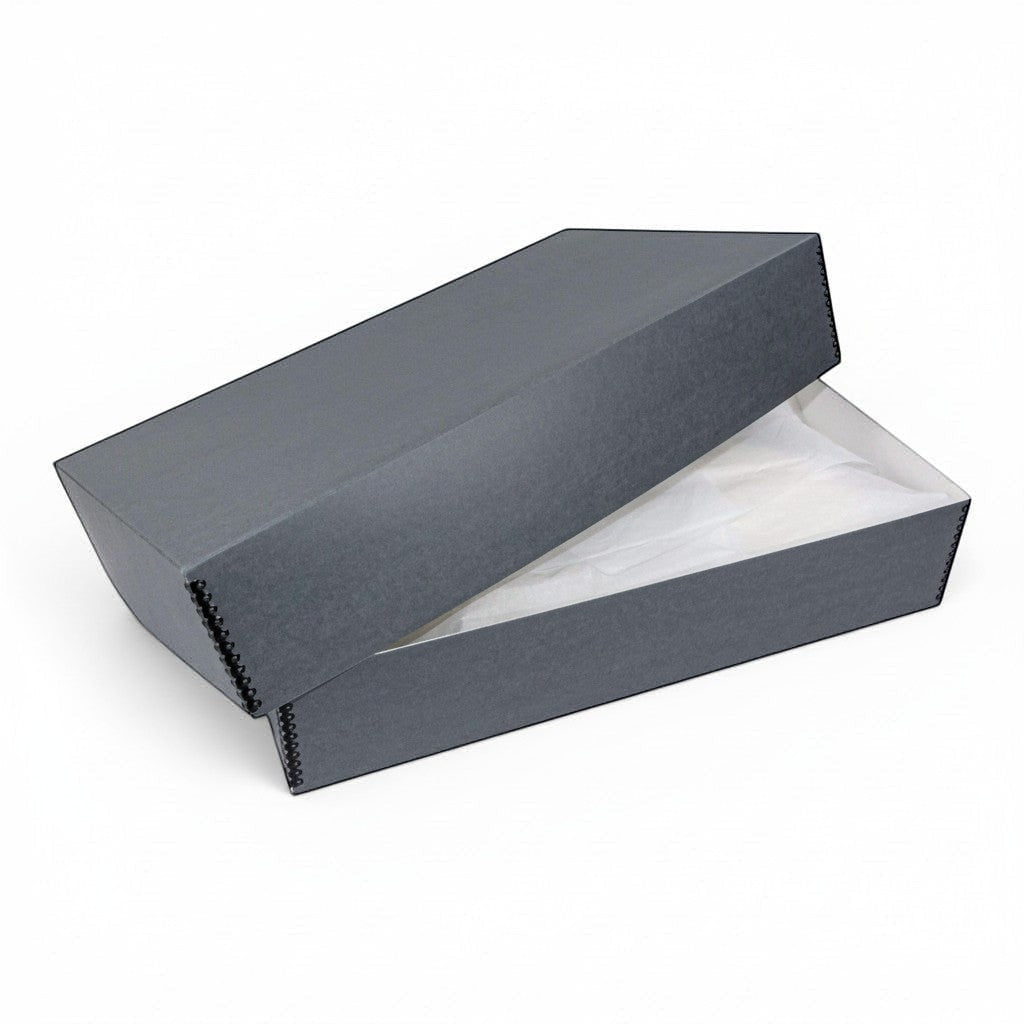 Kept Store acid-free wedding dress storage box in grey with white tissue paper for delicate textile preservation.