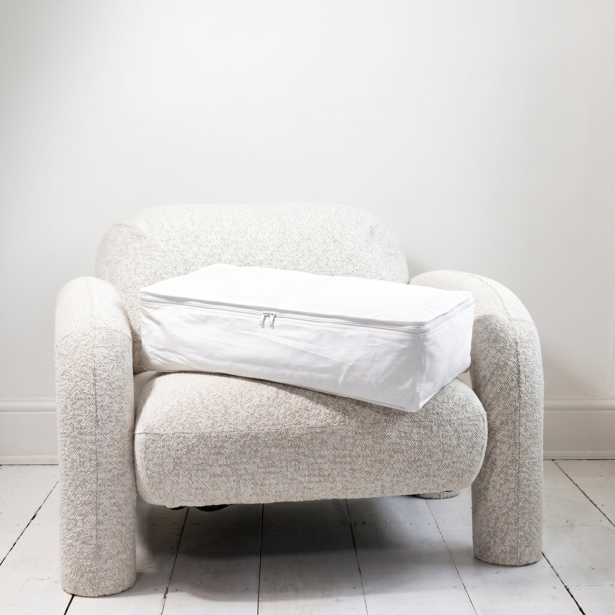 Kept Store large knitwear storage bag in white with its full three-sided zip closed.